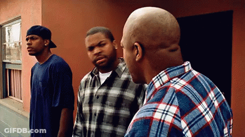 Three Men Standing In Front Of Building Talking GIF