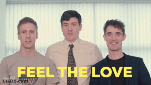 Three Men Standing Next To Each Other With The Words " Feel The Love " Written In Yellow GIF