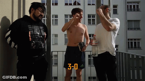 Three Men Standing On Balcony With Number 3 Shorts GIF
