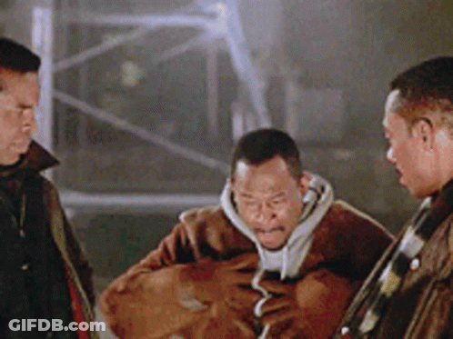 Three Men Standing One Holding Bag GIF