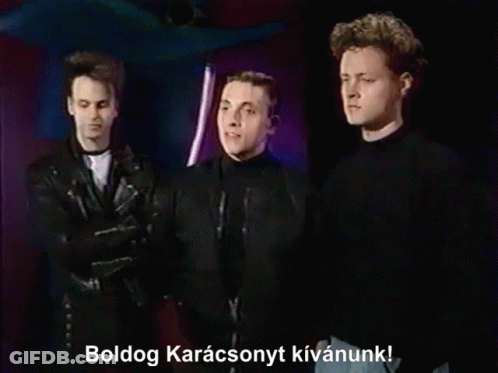 Three Men Standing Together Boldog Karacsonyt Kivanunk GIF