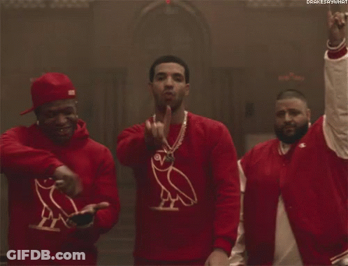 Three Men Wearing Red Sweaters With An Owl On Them Are Standing Next To Each Other . GIF