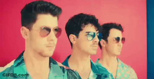 Three Men Wearing Sunglasses And Shirts Are Standing Next To Each Other . GIF