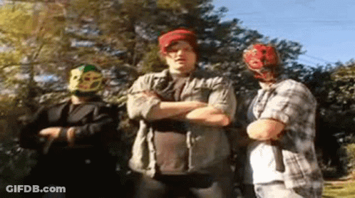 Three Men With Arms Crossed, One Masked GIF
