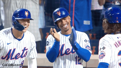Three Mets Baseball Players Are Standing On The Field Laughing GIF