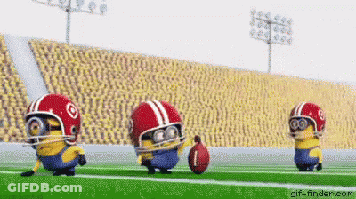 Three Minions Are Playing Football On A Field Wearing Helmets And Goggles . GIF