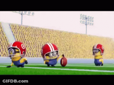 Three Minions Wearing Football Helmets Are Running On A Field With A Ball GIF