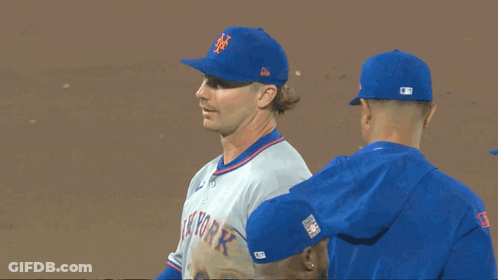 Three New York Mets Baseball Players Are Standing On The Field GIF