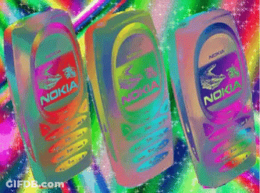 Three Nokia Cell Phones Are Lined Up In A Row GIF