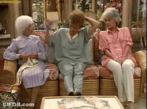 Three Older Women Are Sitting On A Couch In A Living Room . One Of The Women Is Wearing A Pink Shirt . GIF