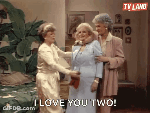 Three Older Women Standing In Living Room Saying I Love You Two GIF