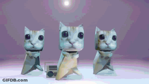 Three Origami Cats Are Standing Next To Each Other On A White Surface GIF