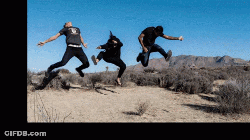 Three People Are Jumping In The Air With One Wearing A T-Shirt That Says ' Freedom ' GIF