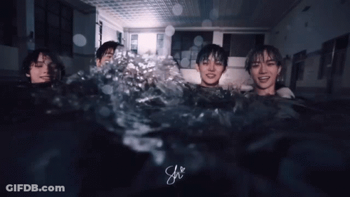 Three People Are Swimming In A Pool With The Letters Sh Visible GIF