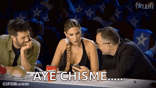 Three People One Holding Phone Saying Aye Chisme GIF