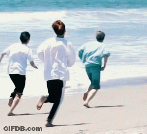 Three People Running On A Beach GIF