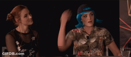 Three People Sitting At Table With Hands On Head GIF