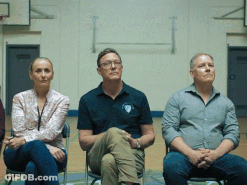 Three People Sitting With SDS Shirt GIF