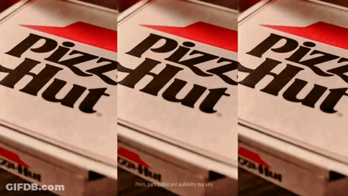 Three Pizza Hut Boxes Are Sitting On A Wooden Table GIF