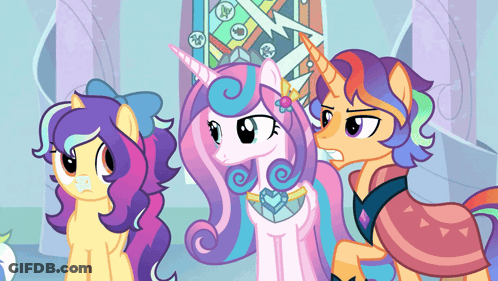Three Ponies Standing Together One With Unicorn Horn GIF