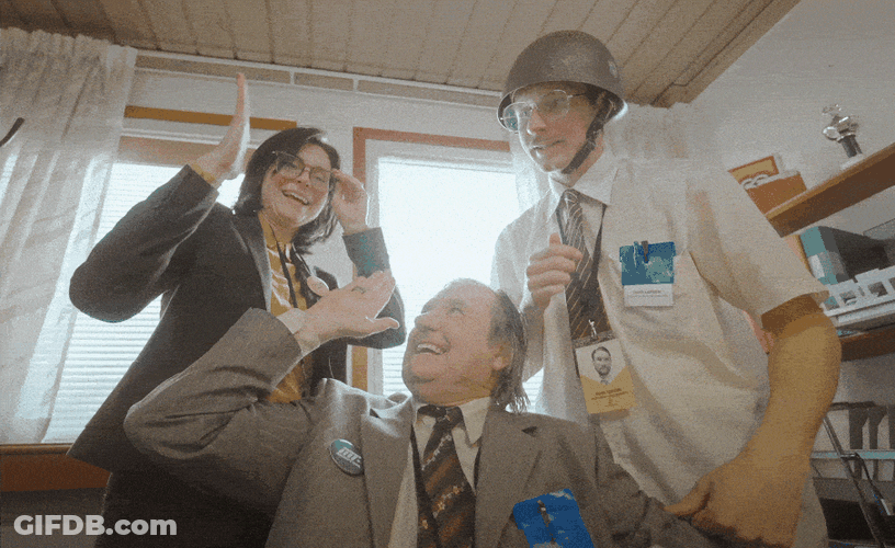 Three Professionals High Five Collaboration GIF