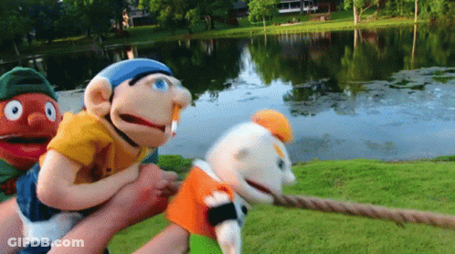 Three Puppets Pulled By Rope GIF