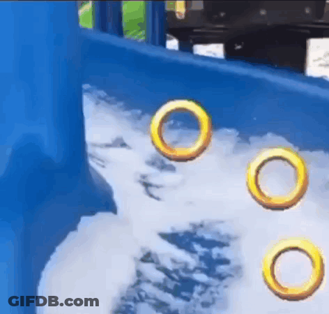 Three Rings Floating In Water On Playground Slide GIF