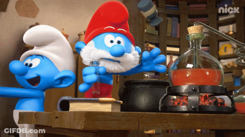 Three Smurfs Are Standing Around A Table With A Nick Logo On The Bottom Right GIF