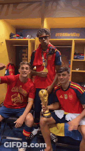Three Soccer Players Are Posing For A Picture In A Locker Room With A Sign That Says #Fifaworldcup GIF