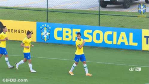 Three Soccer Players Are Running On A Field In Front Of A Banner That Says Cbf Social Tod GIF
