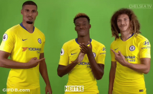 Three Soccer Players In Yellow Jerseys GIF