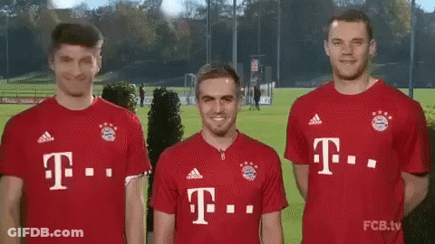 Three Soccer Players Red T-Mobile Jerseys Together GIF
