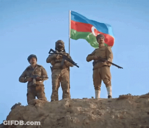 Three Soldiers Standing On Hill With Flag GIF