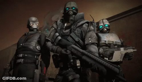 Three Soldiers With Gas Masks And Guns Standing Together GIF