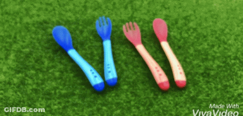 Three Spoons And A Fork On Green Surface GIF