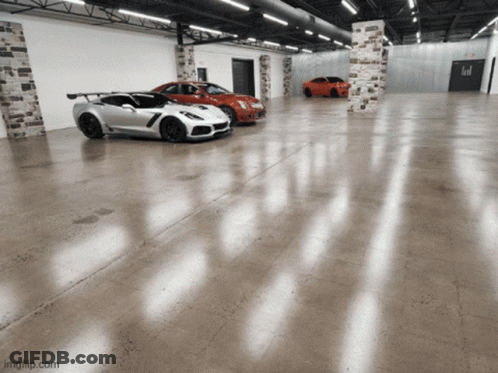 Three Sports Cars Are Parked In A Garage With Imgflip.com At The Bottom Right GIF