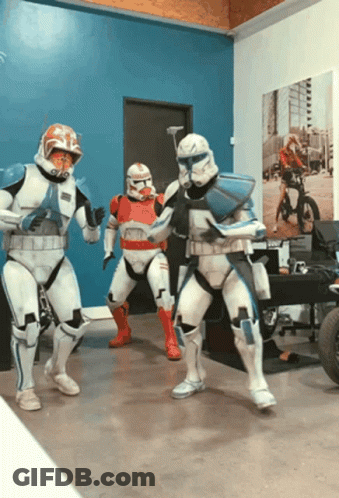Three Stormtroopers Dancing In Room With Blue Wall GIF