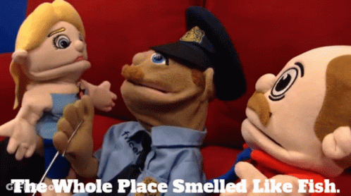 Three Stuffed Animals Are Sitting On A Couch With The Words The Whole Place Smelled Like Fish Below Them GIF