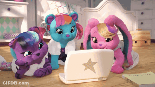 Three Stuffed Animals Look At A Laptop With A Star On It GIF