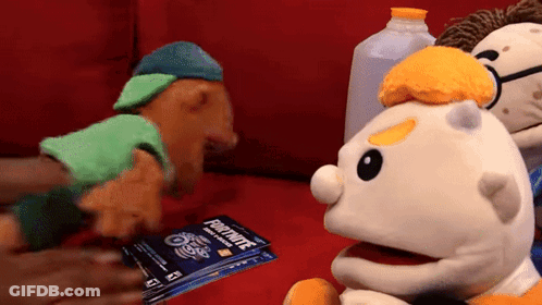 Three Stuffed Animals On Red Couch Holding Fortnite Gift Card GIF