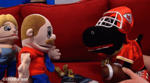 Three Stuffed Animals On Red Couch With Chiefs Uniform GIF
