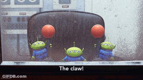 Three Toy Story Aliens Are Holding Balls In Their Hands With The Caption The Claw GIF