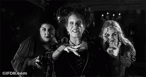 Three Witches Standing Next To Each Other In Room GIF