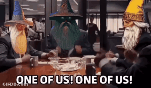 Three Wizards Sitting At Table One Of Us GIF