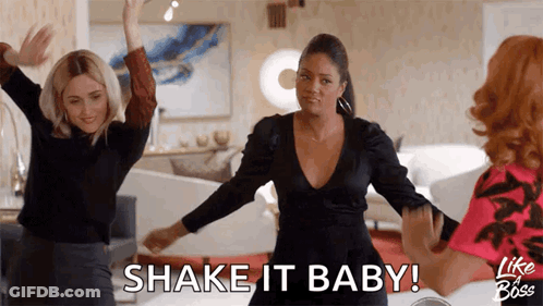 Three Women Are Dancing In A Living Room And One Of Them Is Saying Shake It Baby GIF