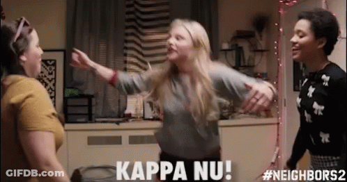 Three Women Are Dancing In A Room And One Of Them Is Saying Kappa Nu ! GIF