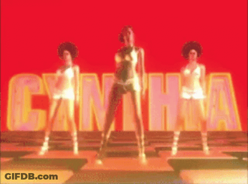 Three Women Are Dancing In Front Of A Sign That Says Cantha GIF