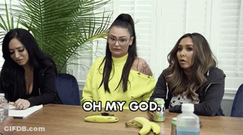 Three Women Are Sitting At A Table With Bananas And A Can Of Soda And One Of Them Is Saying `` Oh My God '' . GIF