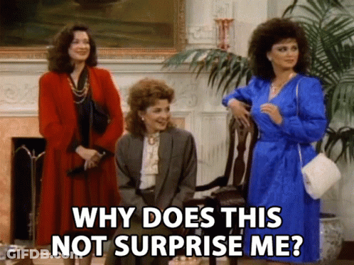 Three Women Are Standing In A Living Room And One Of Them Is Asking Why Does This Not Surprise Me GIF