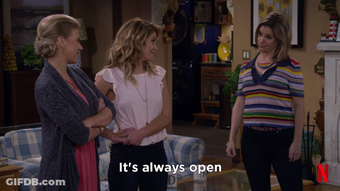 Three Women Standing In Living Room Says It's Always Open GIF